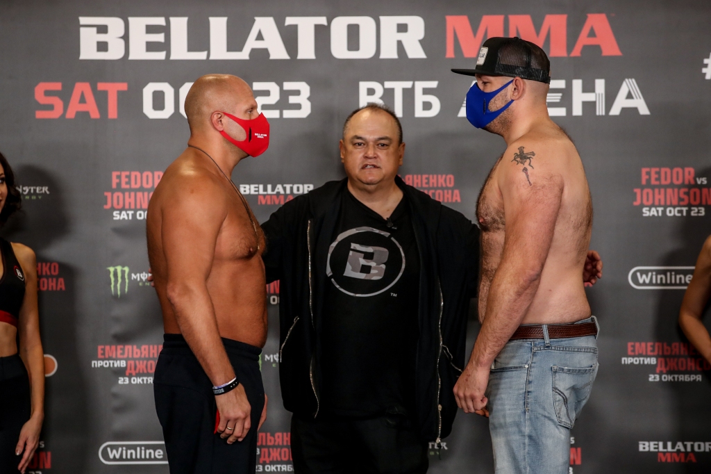 Fedor Emelianenko and Timothy Johnson face each other at a ceremonial weigh-in conference.